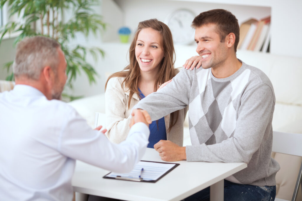 Young couple having conversation with consultant. See more LIFESTYLE and MEDICAL images with this COUPLE and DOCTOR or CONSULTANT. Click on image below for lightbox.